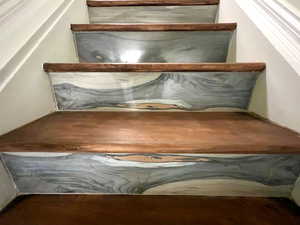 Dreamy ceramic tile facing on staircase.