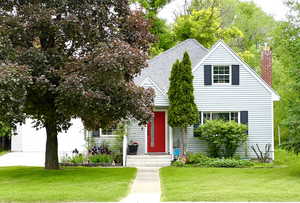 Curb appeal on a tree lined street in an amazing location!