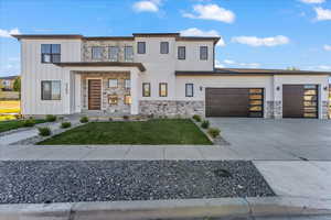 View of front of home featuring a garage