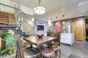 Dining space featuring brick wall