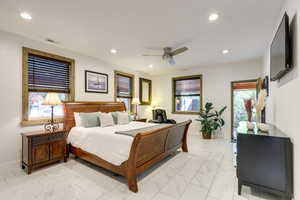 Master Bedroom featuring ceiling fan and light tile floors