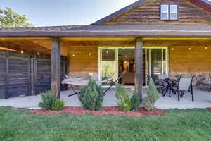 Exterior space with a lawn and a patio area