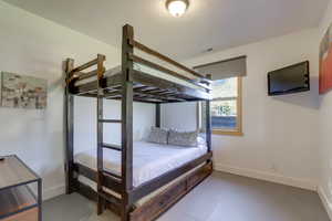 Bedroom with tile floors