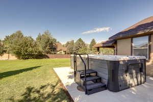 View of yard featuring a hot tub