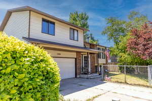 View of front of property with a garage