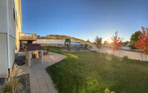 View of yard featuring a patio and a playground