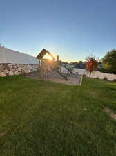 View of yard featuring a playground and a water view