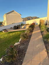 View of yard featuring a patio and a mountain view