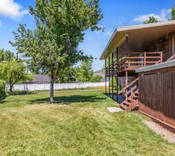 View of yard featuring a deck