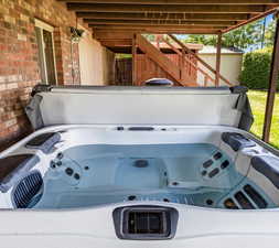 Exterior details with a jacuzzi