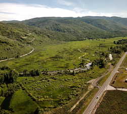 Birds eye view of property featuring a rural view and a mountain view