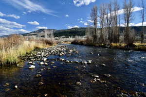 Property view of water with a mountain view