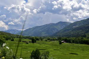 Property view of mountains with a rural view