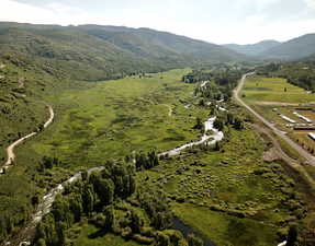 Birds eye view of property featuring a mountain view