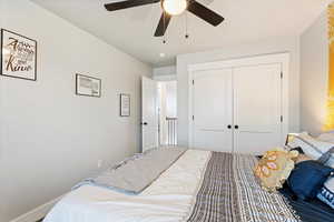 Bedroom with a closet and ceiling fan