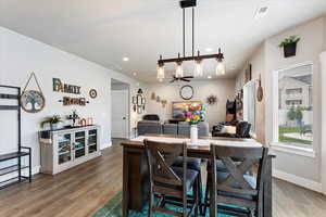 Dining space featuring ceiling fan and hardwood / wood-style floors