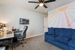 Carpeted office with ceiling fan