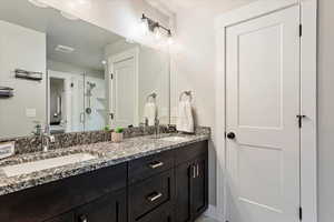 Bathroom with double vanity and walk in shower