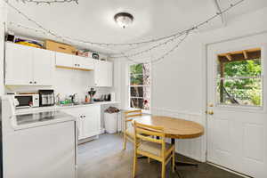 Kitchen featuring light hardwood / wood-style floors, sink, a healthy amount of sunlight, and range