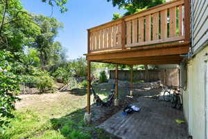 View of yard with a wooden deck