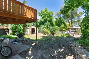 View of yard featuring a storage shed