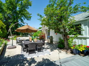 View of patio with an outdoor living space and grilling area