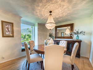 Dining space with a chandelier, hardwood / wood-style flooring,