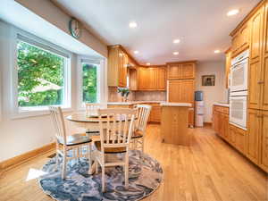 Dining area featuring light hardwood / wood-style floors and sink