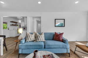 Living room with hardwood / wood-style flooring