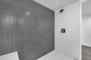 Bathroom featuring tiled shower