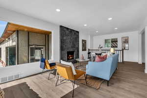 Living room featuring a fireplace and hardwood / wood-style flooring