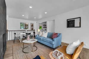 Living room with light hardwood / wood-style flooring