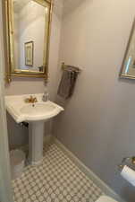 Powder room featuring tile floors