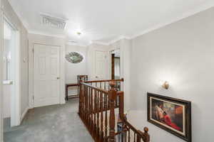 Hall with carpet and ornamental molding