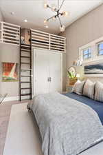 2nd floor bedroom featuring loft above closet