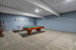 Game room with beamed ceiling, carpet, and pool table