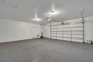 Garage featuring a garage door opener