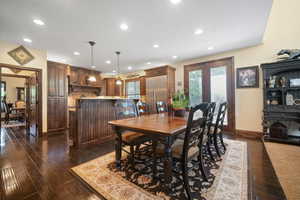 Dining area featuring french doors and dark wood-type flooring