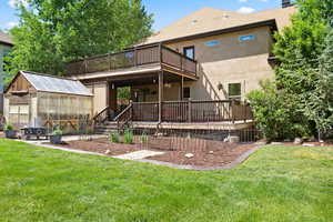 Rear view of property featuring a yard