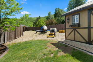 View of yard with an outdoor structure