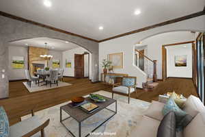 Virtually Staged Living room featuring ornamental molding, an inviting chandelier, and hardwood / wood-style floors