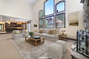 Virtually Staged: Carpeted living room featuring a high ceiling