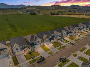 Aerial view at dusk featuring a mountain view