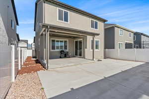 Rear view of property with a patio