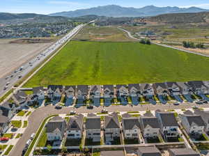 Birds eye view of property with a mountain view