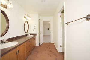 Master Bathroom featuring dual bowl vanity jetted tup and separate shower