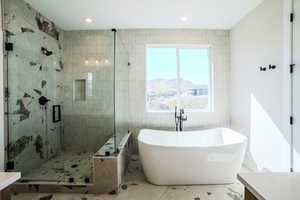 Bathroom with vanity and plus walk in shower