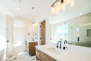 Bathroom with plus walk in shower and vanity