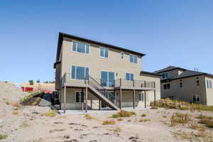 Back of house featuring a deck