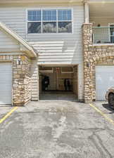 Attached garage w 2 additional parking spaces & storage